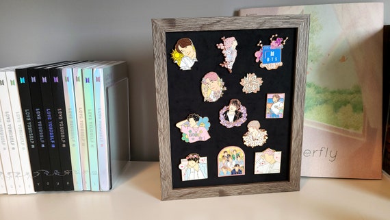 Shadow box for lapel pins, with stickers added to give unique and
