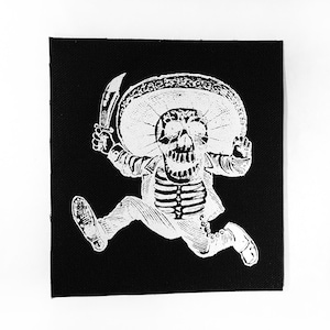 May include: A white skeleton wearing a sombrero and holding a knife runs across a black background.