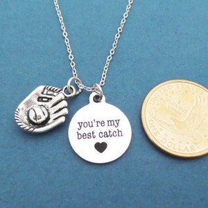 May include: Silver necklace with a baseball glove charm and a round pendant that says "you're my best catch" with a small heart cutout.