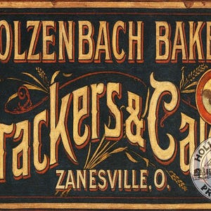 May include: Vintage sign for Stolzenbach Bakery, featuring the text "Crackers & Cakes" in a decorative font. The sign is in a dark blue background with gold and red accents, and includes the location "Zanesville, O."