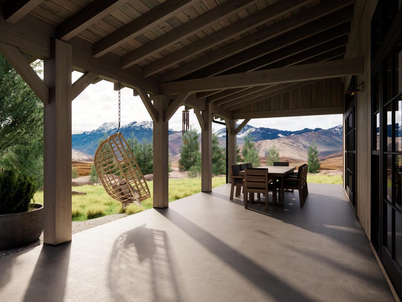 May include: A covered patio with a hanging wicker chair, a dining table, and chairs. The patio has wooden beams and columns. The background features a mountain range and green landscape. The patio floor is concrete.