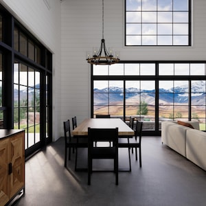 May include: A modern dining room with a large window overlooking a mountain range. The room features a wooden dining table with six black chairs, a white sofa, and a wooden cabinet. A chandelier hangs above the table.