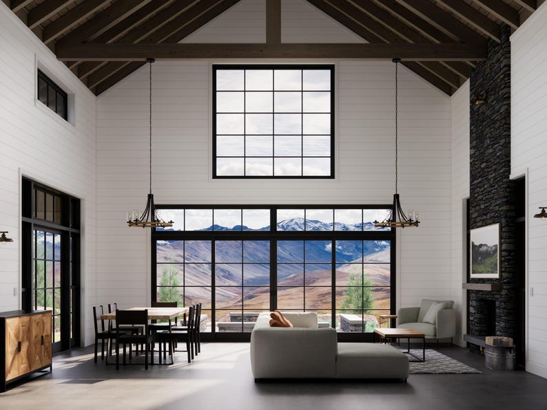 May include: Spacious, modern living room with large windows offering mountain views. Features include a sectional sofa, dining table, fireplace, and decorative chandeliers. The room has white walls, dark trim, and a high, wood-beamed ceiling.