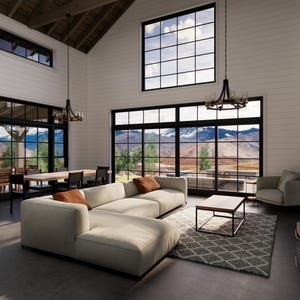 May include: A spacious living room with large windows offering a scenic mountain view. Features a cream-colored sectional sofa, a square coffee table, and a patterned rug. The room is illuminated by chandeliers and natural light.