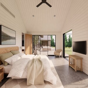 Interior shot of the master bedroom in Mill Farm, a home design by Turnervisual. The walls are clad in white shiplap and the floor is polished concrete. A large king sized bed is in the center of the room and is underlaid by a rug.