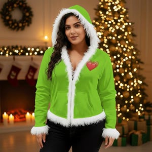 May include: A lime green hooded jacket with white faux fur trim around the hood, cuffs, and front. The jacket has a red heart graphic on the chest and a front pocket. The jacket is open, revealing a black top.