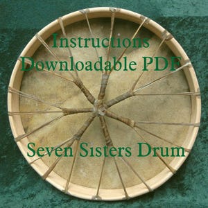 May include: A close-up of a Seven Sisters Drum with brown leather lacing and the text "Instructions Downloadable PDF" on the top of the drum.