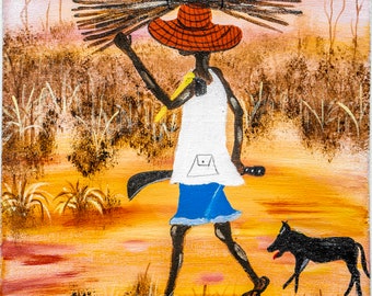 Ein Landwirt trägt Feuerholz auf dem Kopf