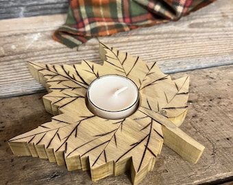 Maple leaf hand cut from maple wood and burned by hand. Each one is unique, decorative and realistic. Nice tea light candle in middle