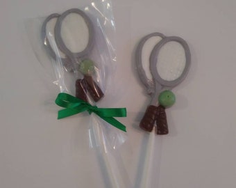 Tennis rackets and ball chocolate lollipops