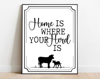 May include: Black and white printable wall art with a cow and calf silhouette and the text "Home is where your herd is."