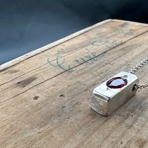 a wooden table with a metal object on it