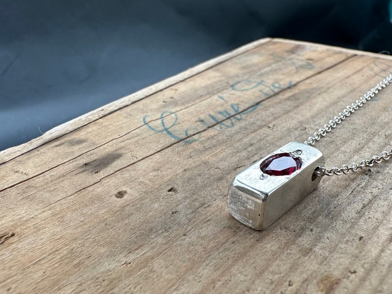 a wooden table with a metal object on it