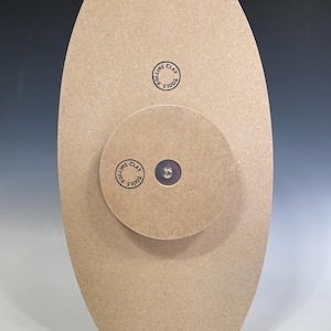 May include: A brown wooden pottery wheel with a metal center and a "Tools Clay Rollins" logo on the side.