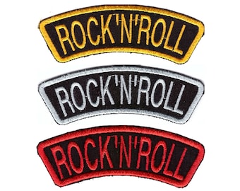 May include: Three embroidered patches with the text "ROCK 'N' ROLL". The top patch has a gold border and lettering, the middle one has a silver border and lettering, and the bottom one has a red border and lettering. All patches have a black background.