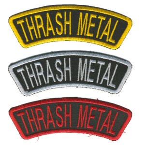May include: Three embroidered patches with the text "THRASH METAL" in a curved banner design. The patches are in yellow, silver, and red, each with a black border and background.