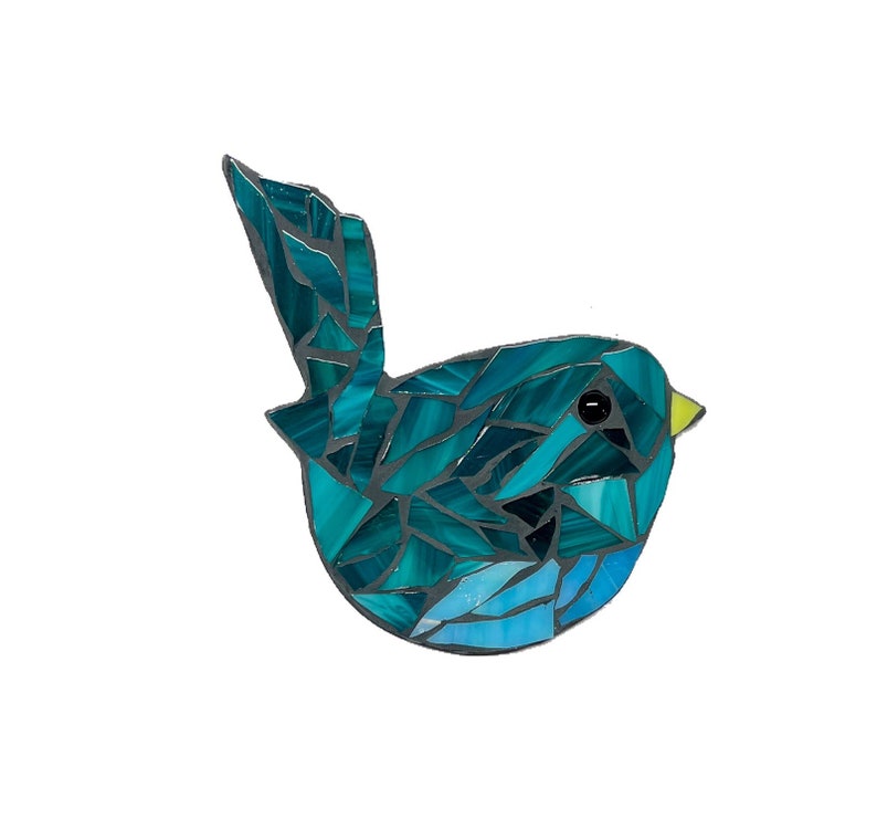 May include: A blue and green mosaic bird with a yellow beak. The bird is made of small pieces of glass and is a unique and colorful piece of art.