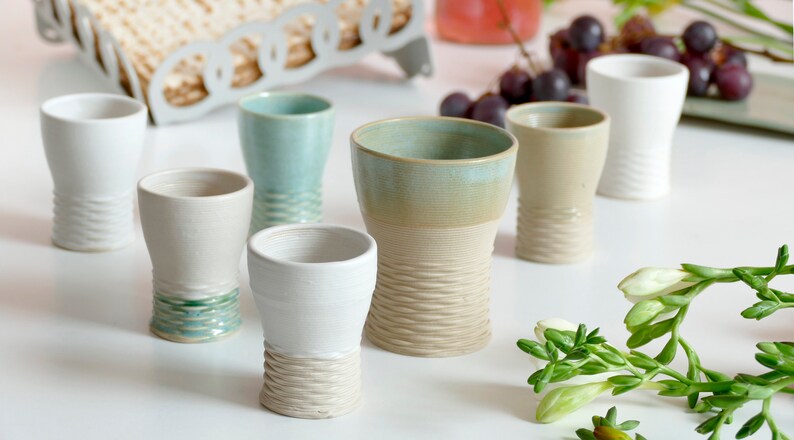 Mystery box of Kiddush cups set - The box's contents stay the same - the glazes varies in off white, beige and mint green shades!
Pictures show different combinations of glazes - the exact colors combination of your set is a surprise.