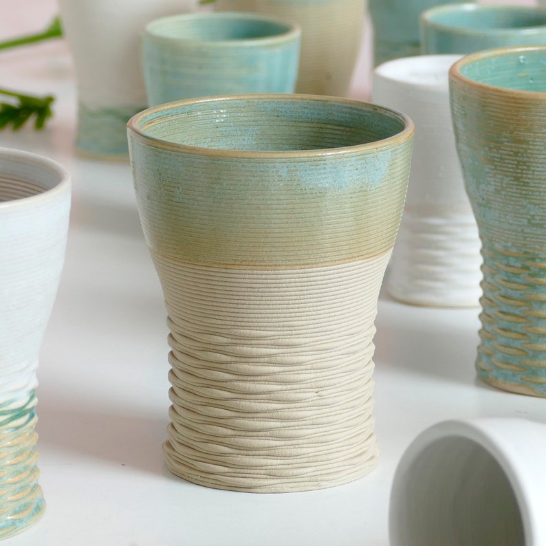 Mystery box of Kiddush cups set - The box's contents stay the same - the glazes varies in off white, beige and mint green shades!
Pictures show different combinations of glazes - the exact colors combination of your set is a surprise.
