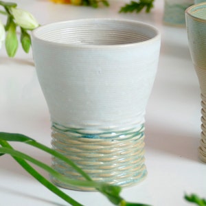 Mystery box of Kiddush cups set - The box's contents stay the same - the glazes varies in off white, beige and mint green shades!
Pictures show different combinations of glazes - the exact colors combination of your set is a surprise.