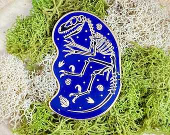 Velociraptor Skeleton Enamel Pin: Gold & Blue Dinosaur Fossil