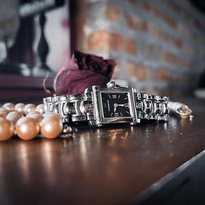 Vintage Philippe Charriol Columbus watch, steel case, black dial