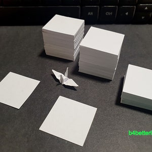 1.000 fogli di colore bianco da 1 pollice Kit di piegatura della carta della gru di origami. 1 "x 1". (serie di carta KR). #CRK-108.