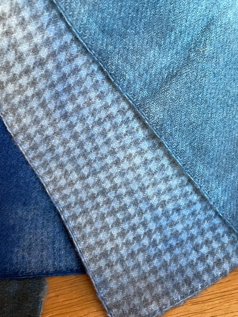 houndstooth over dyed wool dyed blue and a blue plaid wool fabric