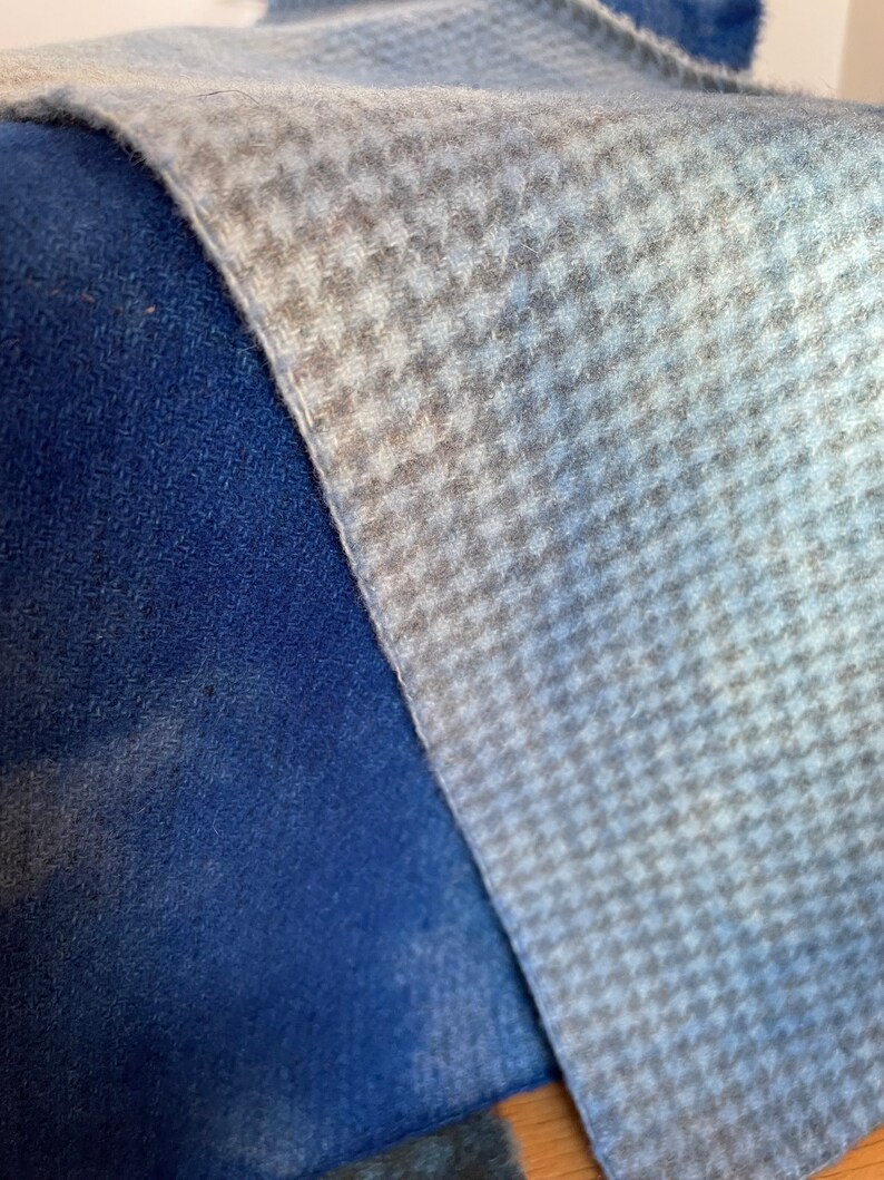 light blue hand dyed houndstooth wool fabric and a dark royal blue plain hand dyed wool fabric