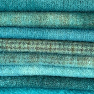 May include: A rustic wooden sign with the text "Welcome to our home" in white lettering. The sign features a distressed finish and a simple, inviting design, perfect for entryway decor.