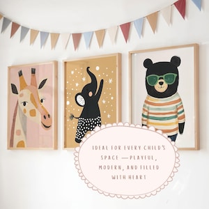 May include: Three framed animal art prints: a giraffe, an elephant, and a bear wearing sunglasses. The giraffe is on a pink background, the elephant on a mustard background, and the bear on a white background. A colorful banner hangs above the prints.