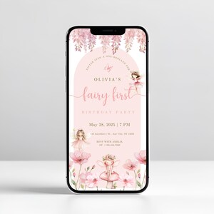 May include: A smartphone displays a pink fairy-themed birthday party invitation. The invitation features the text "Olivia's fairy first birthday party" with floral and fairy illustrations. The date and time are also included.