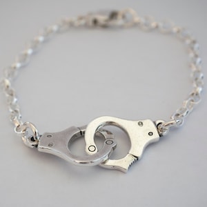 Linked handcuff bracelet