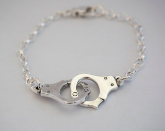 Linked handcuff bracelet