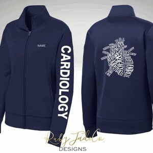 May include: Navy blue zippered jacket with the word "CARDIOLOGY" printed on the left sleeve and a white outline of a heart with the anatomical terms for the heart printed inside on the back. The text "NAME" is printed on the front of the jacket.