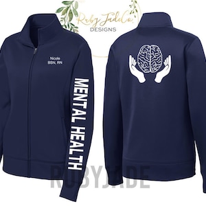 May include: Navy blue zip-up jacket with a white brain graphic on the back and the text "Mental Health" on the left sleeve. The front of the jacket has the text "Nicole BSN, RN".