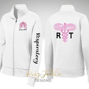 May include: White zippered jacket with a pink medical symbol and the letters "RT" on the back. The left sleeve has the word "Respiratory" written vertically in black and the text "Jessie RRT" on the front.