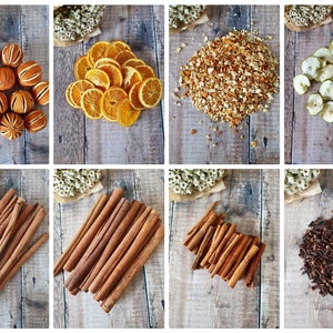 Può includere: Una collezione di frutta secca e spezie disposte su una superficie di legno rustico. L'immagine include arance secche, fette di mela, bastoncini di cannella e chiodi di garofano, suggerendo ingredienti naturali per artigianato o cucina.