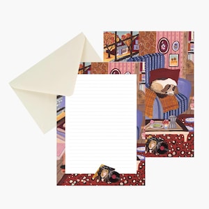 May include: A stationery set featuring a cream-colored envelope and a lined writing sheet with a colorful illustration of a cozy room, a dog resting on a blue armchair, a coffee table with a moka pot, and a leopard print rug on the floor.