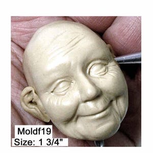 Moldf19 - 1 3/4-inch Face Mold for Mrs. Santa/Smiling Woman, use with polymer clay and other modeling compounds, designed by Maureen Carlson