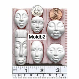 Moldb2 - 6 faces: 2- 1" round, 2- 1" long, 1 1/4" long, 1 1/2" stylized, Plus 5 Texture Designs by Maureen Carlson