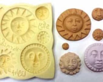 May include: Silicone mould with seven different sun face designs. The mould is yellow and features a variety of sun faces with closed eyes, open eyes, and different facial expressions.