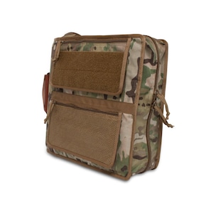 May include: A camouflage-patterned messenger bag with a zipper closure, a brown mesh pocket, and a brown velcro flap with a smaller pocket.