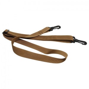 May include: A brown adjustable strap with two black plastic clips. The strap is made of a woven material and is designed for attaching to a bag or other item.