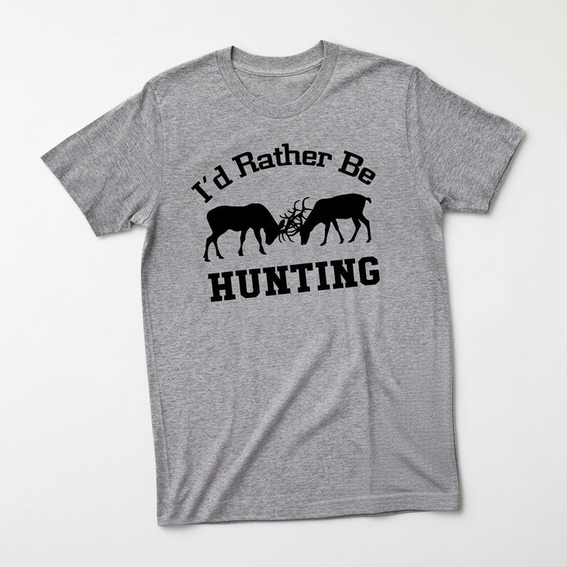 A gray t-shirt with a graphic design featuring two deer heads and the text "I'd Rather Be HUNTING" printed on it.