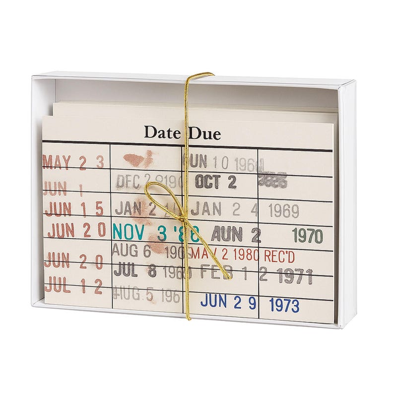A white box containing a set of colorful cards with dates and information printed on them.
