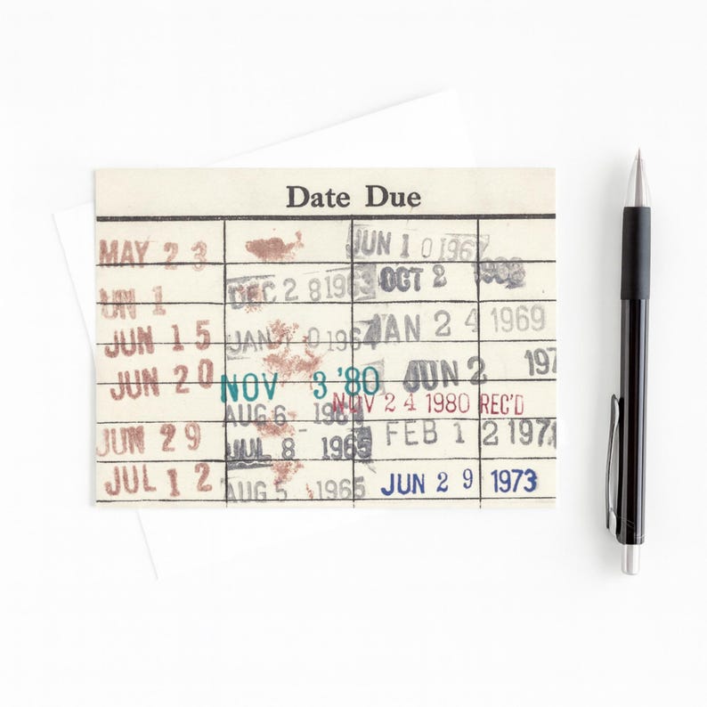a date due card with a pen next to it, placed on a white background.