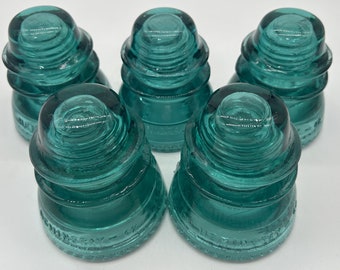 Vintage aqua colored Hemingray 42 glass insulator