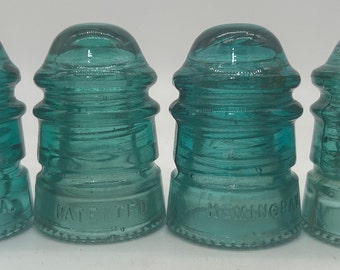 Vintage aqua colored Hemingray No. 12 glass insulator