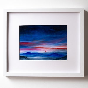 Imagined landscape original oil painting with a red sun. Sunrise above mountains. A5 landscape painting. Red clouds, blue mountains.